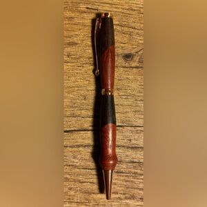 Hand turned wood pen black ink.